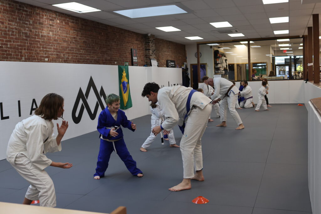 Ascension Jiu jitsu Kids BJJ class with martial arts instructor giving lessons